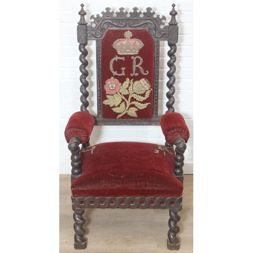 39 - An unusual antique carved oak throne chair with 1731 King George II related embroidery, the chair be... 