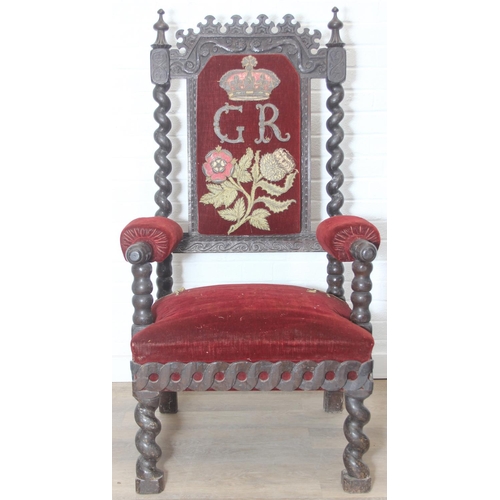 39 - An unusual antique carved oak throne chair with 1731 King George II related embroidery, the chair be... 