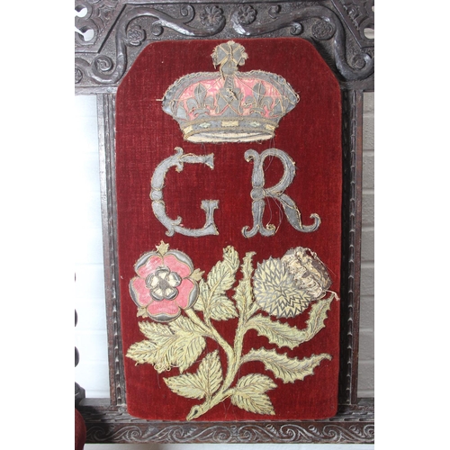 39 - An unusual antique carved oak throne chair with 1731 King George II related embroidery, the chair be... 