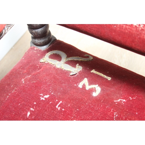 39 - An unusual antique carved oak throne chair with 1731 King George II related embroidery, the chair be... 