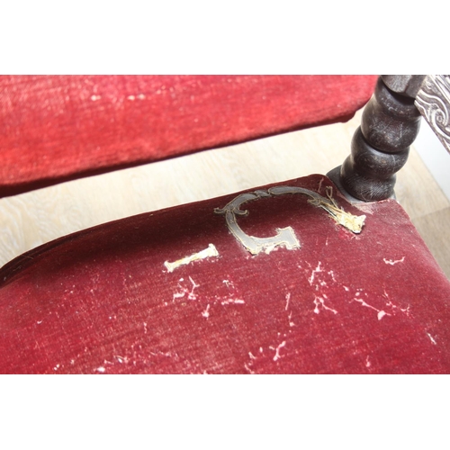 39 - An unusual antique carved oak throne chair with 1731 King George II related embroidery, the chair be... 