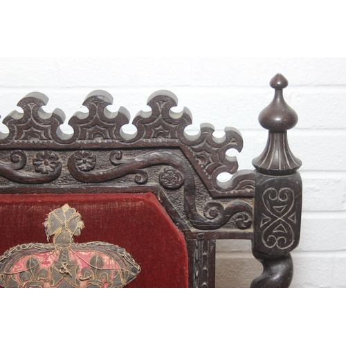 39 - An unusual antique carved oak throne chair with 1731 King George II related embroidery, the chair be... 