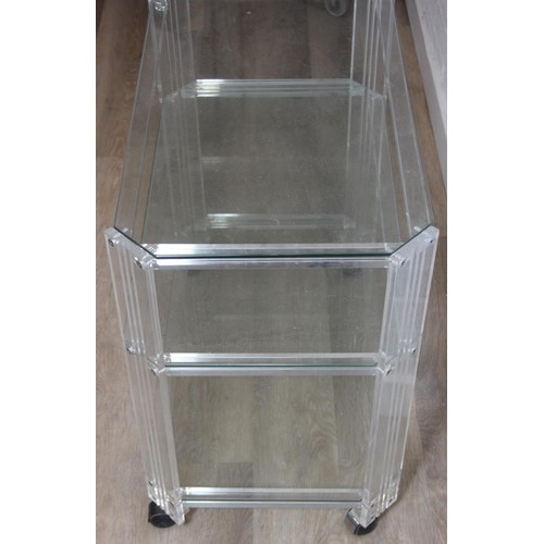 18 - A retro clear Perspex, Acrylic or Lucite serving trolley, three tiers with wheels, likely c.1980's, ... 