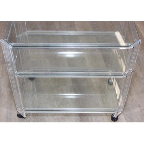 18 - A retro clear Perspex, Acrylic or Lucite serving trolley, three tiers with wheels, likely c.1980's, ... 