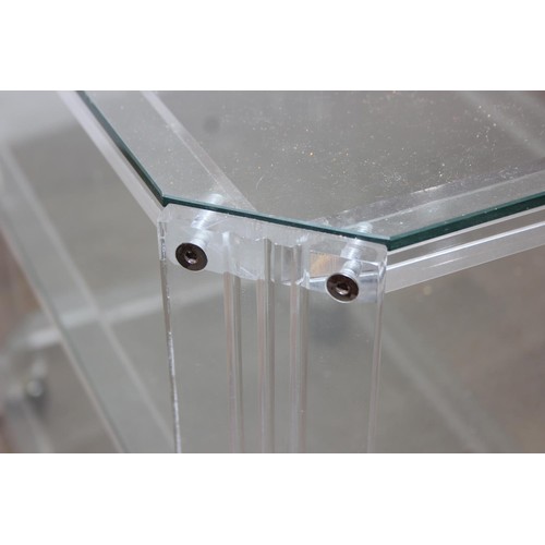 18 - A retro clear Perspex, Acrylic or Lucite serving trolley, three tiers with wheels, likely c.1980's, ... 