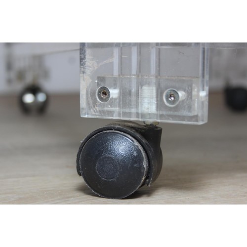 18 - A retro clear Perspex, Acrylic or Lucite serving trolley, three tiers with wheels, likely c.1980's, ... 