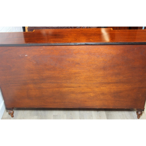 20 - William Tillman Furniture - a Regency style flame Mahogany sideboard, four doors with the central pa... 