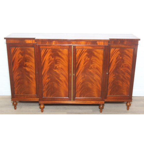 20 - William Tillman Furniture - a Regency style flame Mahogany sideboard, four doors with the central pa... 