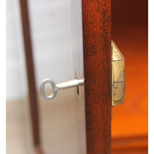 20 - William Tillman Furniture - a Regency style flame Mahogany sideboard, four doors with the central pa... 