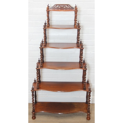 26 - An antique whatnot with six oak tiers and turned rosewood barleytwist supports, 70cm x 27cm x 135cm