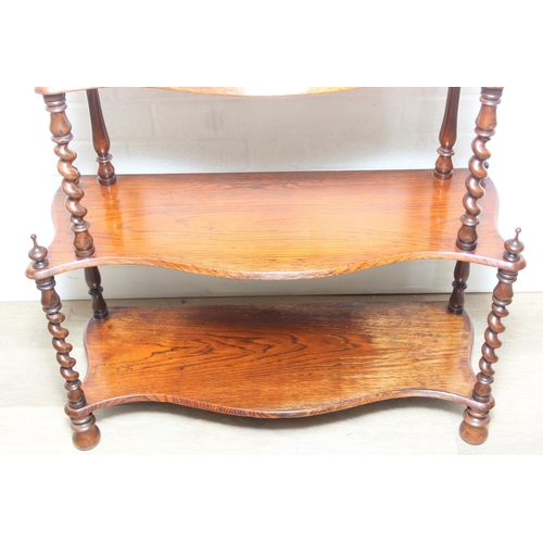 26 - An antique whatnot with six oak tiers and turned rosewood barleytwist supports, 70cm x 27cm x 135cm
