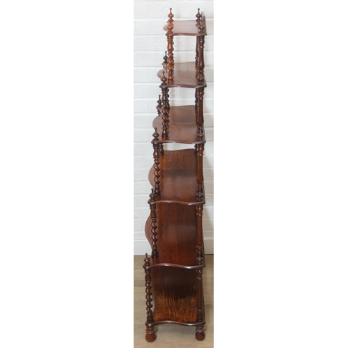 26 - An antique whatnot with six oak tiers and turned rosewood barleytwist supports, 70cm x 27cm x 135cm