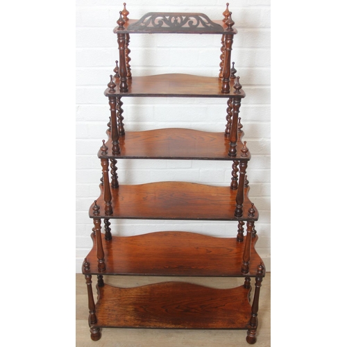 26 - An antique whatnot with six oak tiers and turned rosewood barleytwist supports, 70cm x 27cm x 135cm
