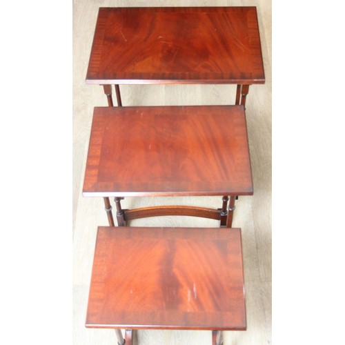 29 - A high quality modern mahogany nest of three tables by Bright's of Nettlebed, the largest 48cm x 33c... 