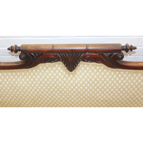 68 - A Victorian roll end sofa or settee with exposed mahogany frame, buff upholstery, 224cm long x 94cm ...