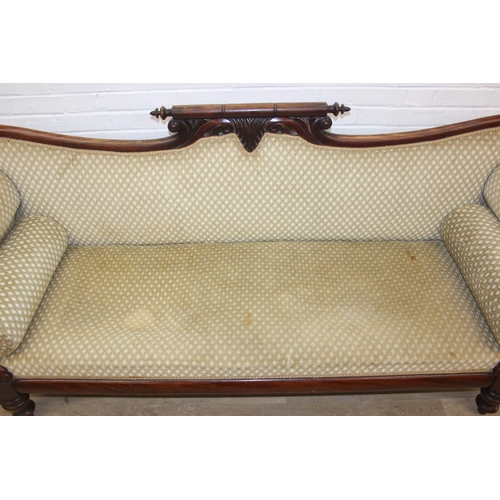 68 - A Victorian roll end sofa or settee with exposed mahogany frame, buff upholstery, 224cm long x 94cm ...