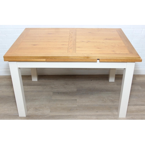 76 - Modern white painted extending dining table with oak top and four matching chairs, the table 68cm x ...
