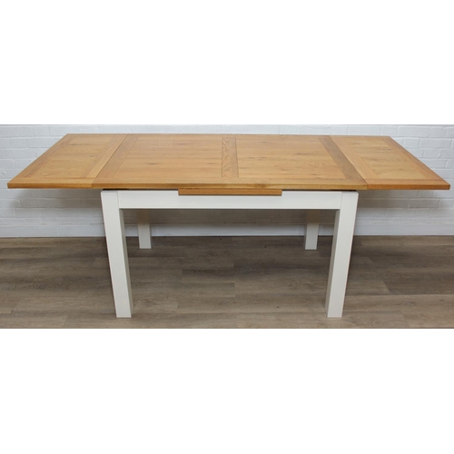 76 - Modern white painted extending dining table with oak top and four matching chairs, the table 68cm x ...