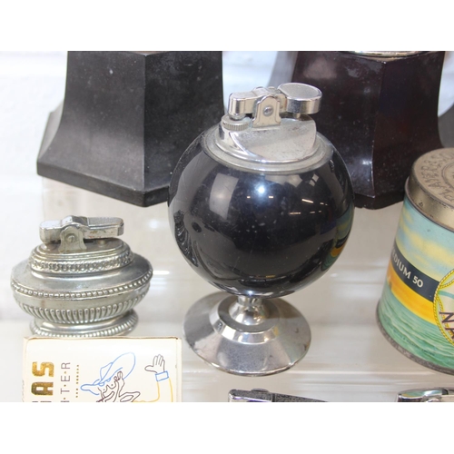 1557 - Qty of assorted smoking related items to inc Bakelite ashtrays, lighters advertising items etc