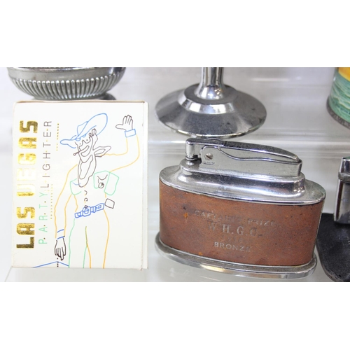 1557 - Qty of assorted smoking related items to inc Bakelite ashtrays, lighters advertising items etc