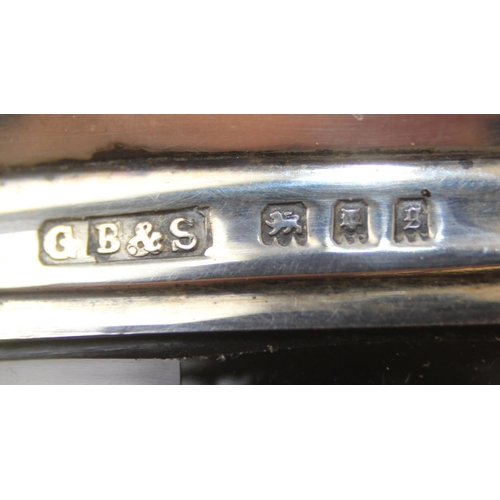 1006 - A leather cased gentleman's travelling vanity set, harlequin pieces but to include four silver toppe... 