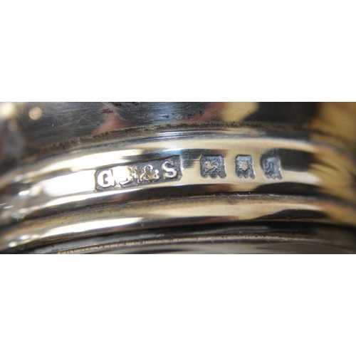 1006 - A leather cased gentleman's travelling vanity set, harlequin pieces but to include four silver toppe... 