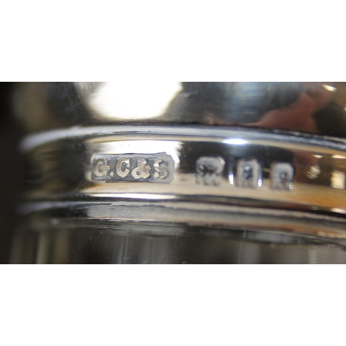 1006 - A leather cased gentleman's travelling vanity set, harlequin pieces but to include four silver toppe... 