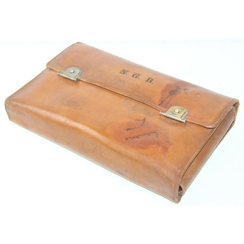 1006 - A leather cased gentleman's travelling vanity set, harlequin pieces but to include four silver toppe... 