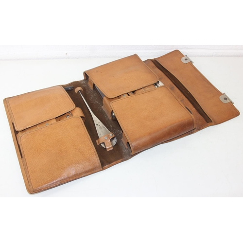 1006 - A leather cased gentleman's travelling vanity set, harlequin pieces but to include four silver toppe... 