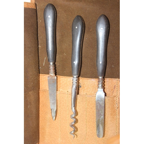 1006 - A leather cased gentleman's travelling vanity set, harlequin pieces but to include four silver toppe... 