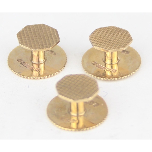 1125 - [3.07g] - a boxed set of three 9ct gold shirt studs of octagonal form with engine turning, marked fo... 