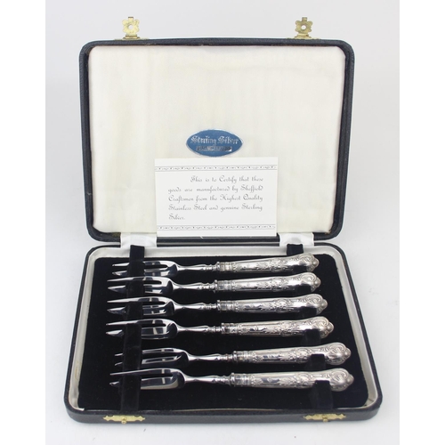 1008 - A boxed set of six silver handled cake forks, marked for Sheffield 1965 by Harrison Brothers, boxed ... 