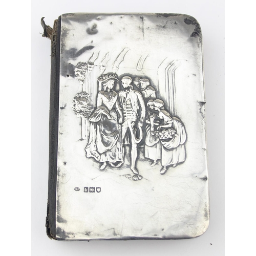1011C - An Edwardian silver mounted prayer book with embossed wedding scene, London 1905 by William Comyns, ... 
