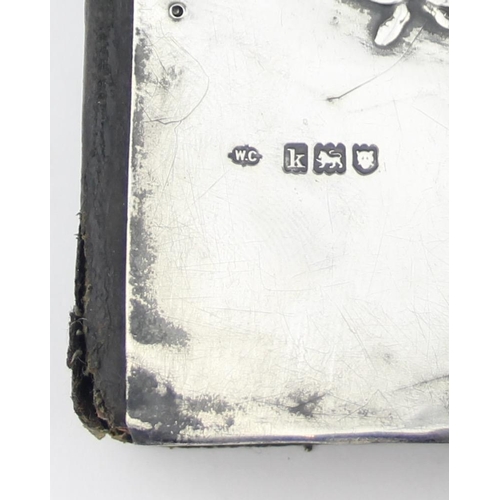 1011C - An Edwardian silver mounted prayer book with embossed wedding scene, London 1905 by William Comyns, ... 