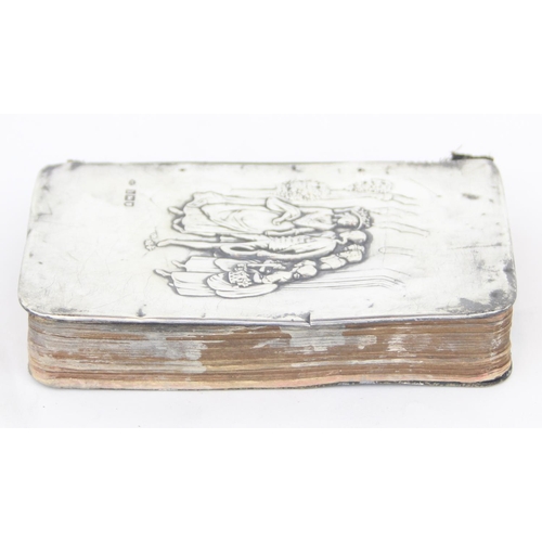 1011C - An Edwardian silver mounted prayer book with embossed wedding scene, London 1905 by William Comyns, ... 