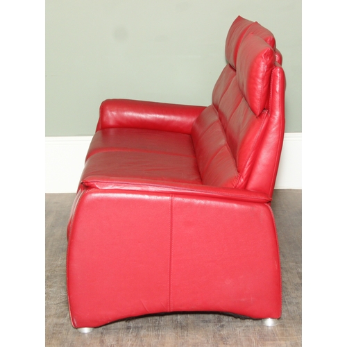 14 - Iolino of Italy - a retro style red leather three seater sofa with three reclining seats, 195cm wide... 