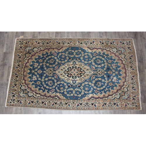 254 - A vintage high quality rug with blue medallion to centre, possibly Turkish, 208cm x 123cm