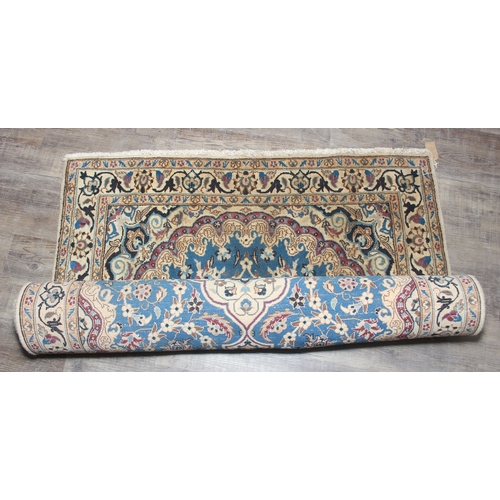 254 - A vintage high quality rug with blue medallion to centre, possibly Turkish, 208cm x 123cm