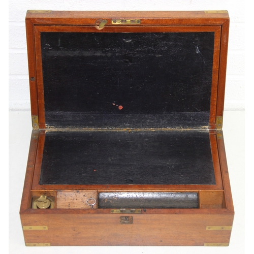 238 - Campaign style mahogany writing slope with brass corners and banding, key and brass topped travel in... 