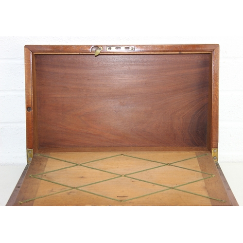 238 - Campaign style mahogany writing slope with brass corners and banding, key and brass topped travel in... 