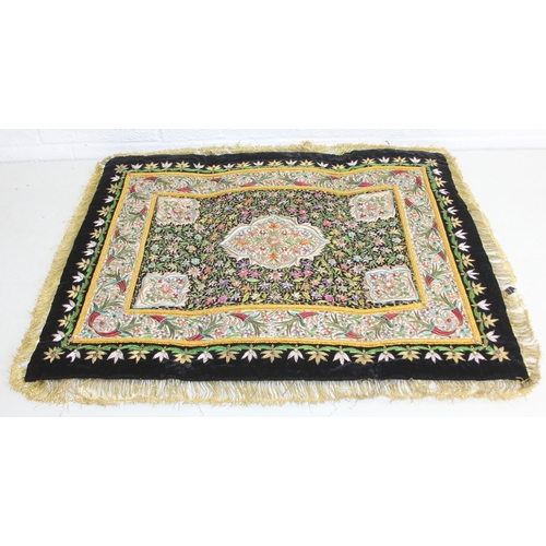 241 - An Indian Zardozi wall hanging with black ground, gilt embroidery and cabochon stones, 64cm x 54cm