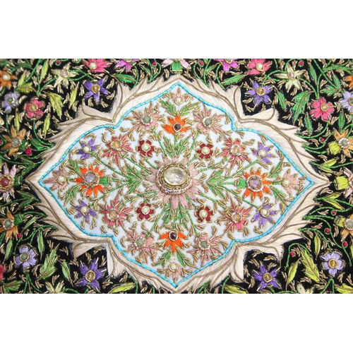 241 - An Indian Zardozi wall hanging with black ground, gilt embroidery and cabochon stones, 64cm x 54cm
