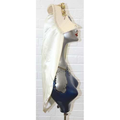 239D - An Art Deco style painted mannequin on adjustable stand, with head dress