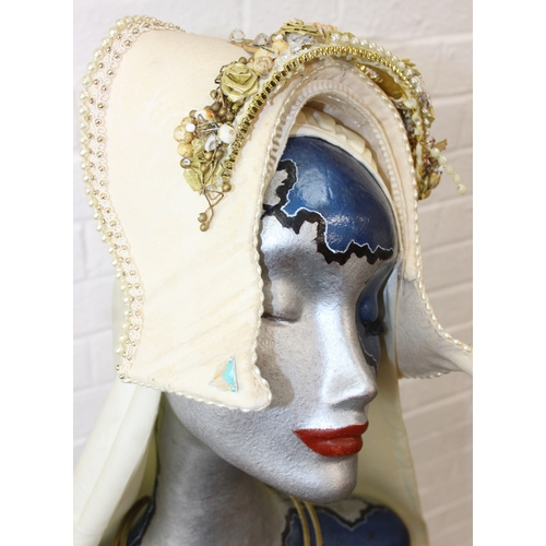 239D - An Art Deco style painted mannequin on adjustable stand, with head dress