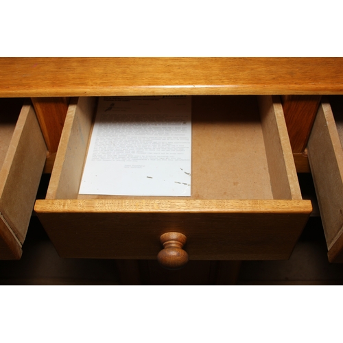 14 - A modern light oak three drawer two door sideboard made by Neil Thompson, 156cm x 55cm x 101cm