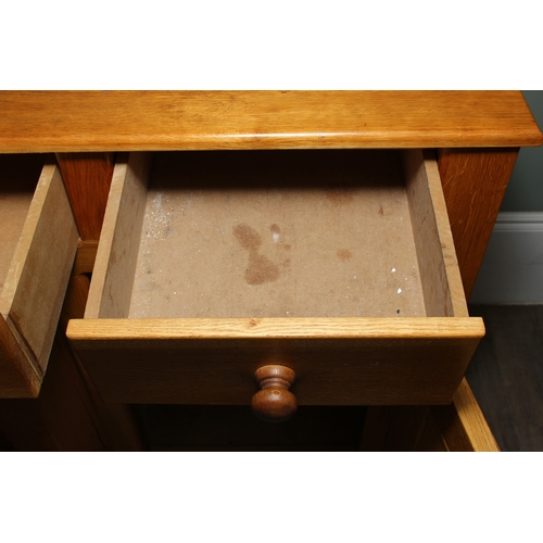 14 - A modern light oak three drawer two door sideboard made by Neil Thompson, 156cm x 55cm x 101cm