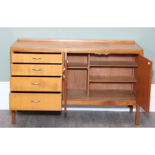 15 - A retro Remploy sideboard with two door cupboard and four drawers, dated 1968 to reverse, 138cm x 46... 