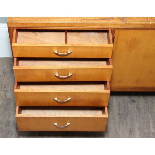 15 - A retro Remploy sideboard with two door cupboard and four drawers, dated 1968 to reverse, 138cm x 46... 