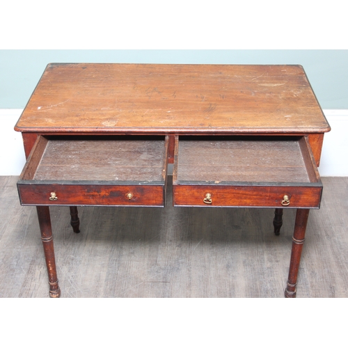 A 19th century mahogany two-drawer writing table with brass handles and ...