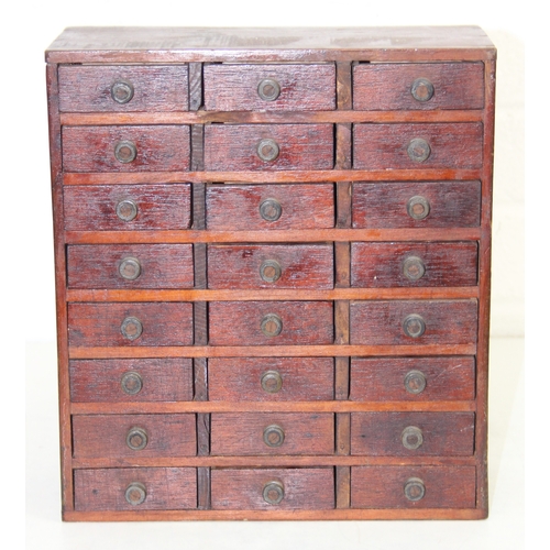 A small vintage multi-drawer engineers or collectors cabinet comprising ...